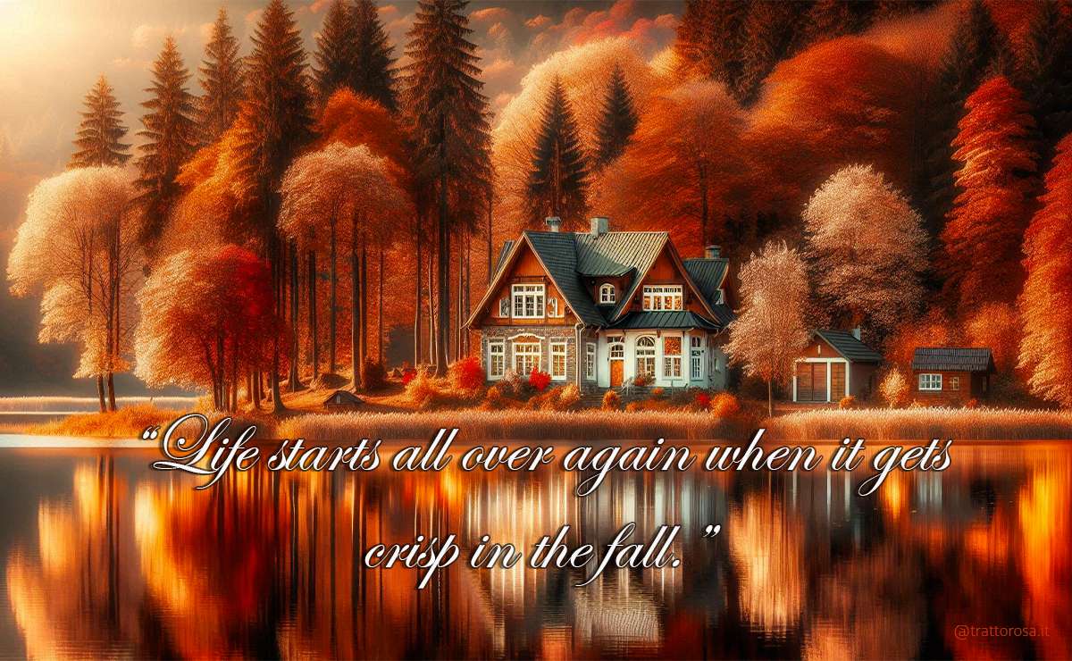 Casa sul lago attorniata da un bosco di alberi in autunno