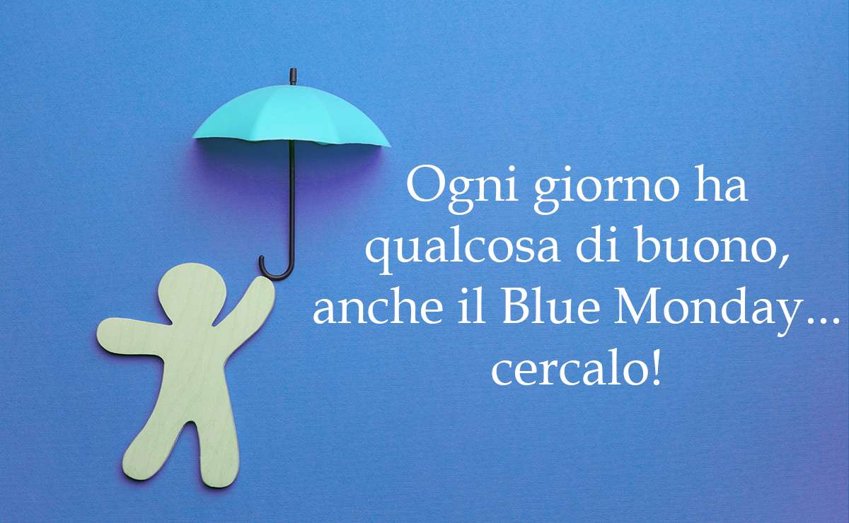 Sagoma di persona in legno che regge un ombrello azzurro con la frase motivazionale "Ogni giorno ha qualcosa di buono, anche il Blue Monday... cercalo!"